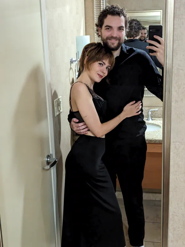 Jacob and Vicki dressed up for a night out, arms around each other
